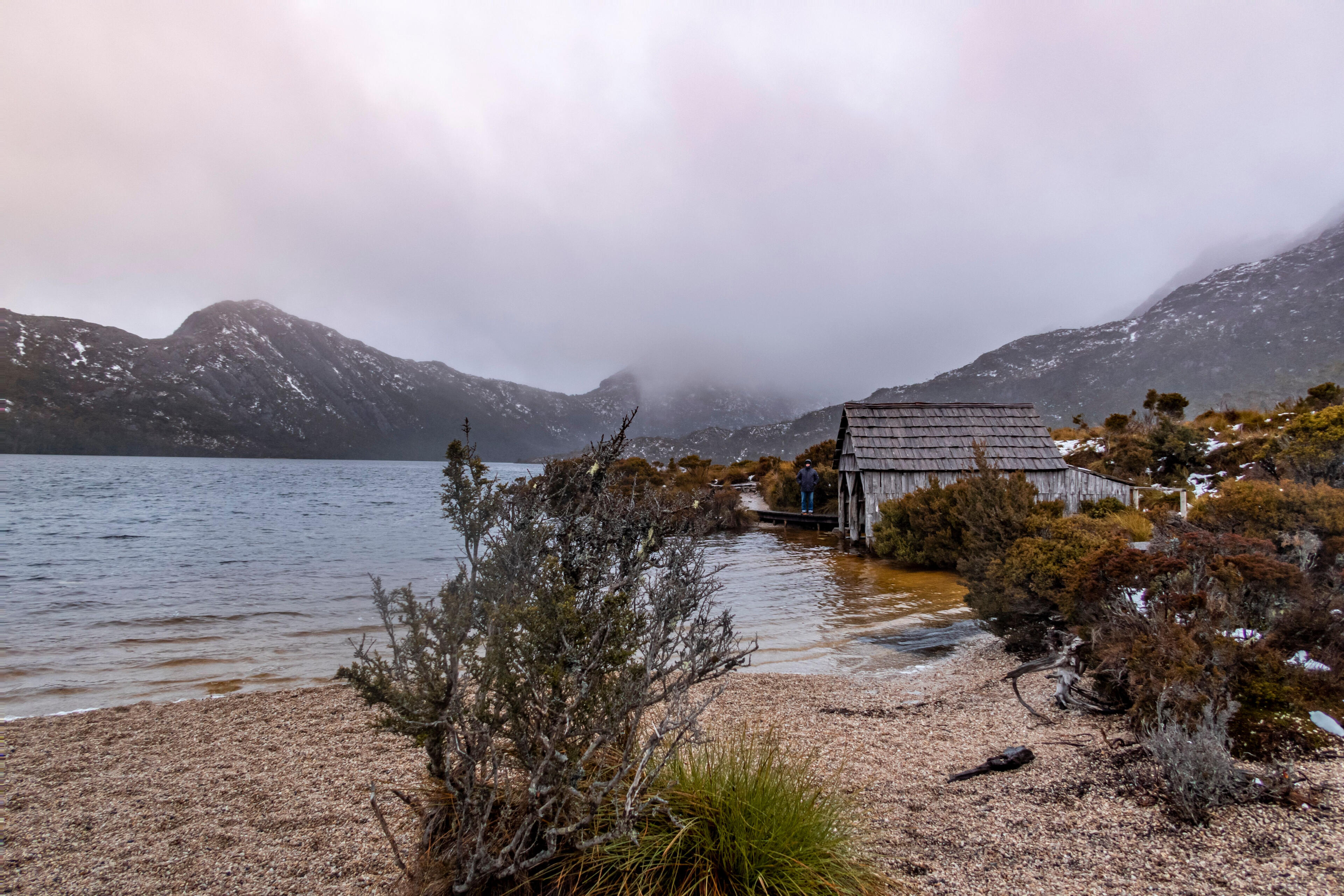Cradle mountain dove lake day trip tasmania A wide shot of the boatshed and cradle mountain landscape in North West Tasmania.